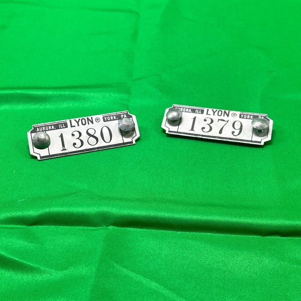 Vintage industrial metal locker number tags or plates from Lyon Metal Products